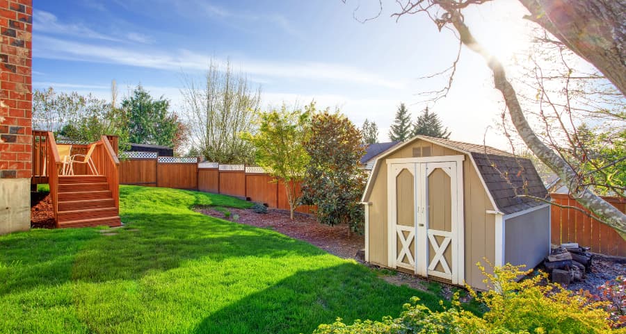 Fenced backyard with storage shed in Denver